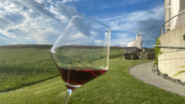 Red wine in Glass on wide farm acreage